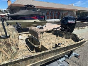 Lowe RX 1860 boat with Mercury outboard motor on display.