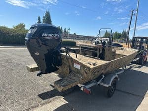 Lowe RX 1860 boat with Mercury outboard engine on trailer.