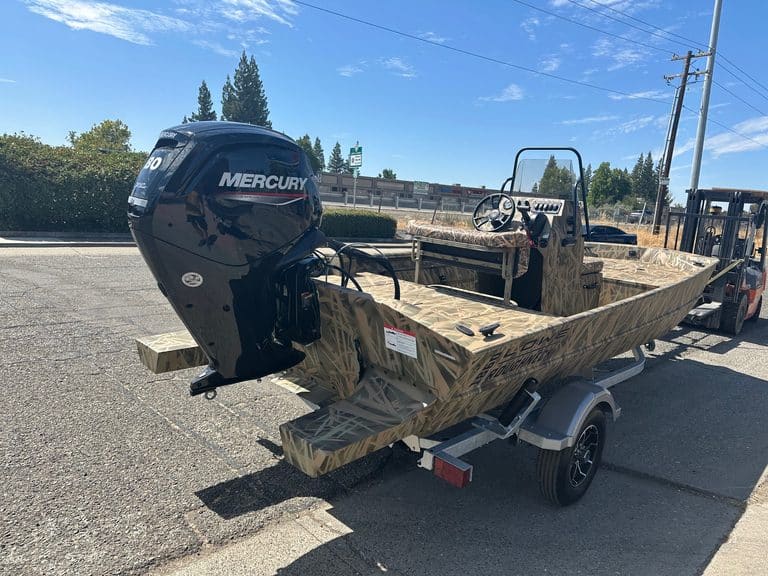 Lowe RX 1860 boat with Mercury outboard engine on trailer.