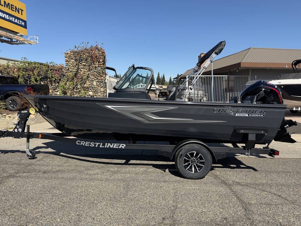 Crestliner 1850 Kodiak WT boat on trailer with Mercury 115HP engine.