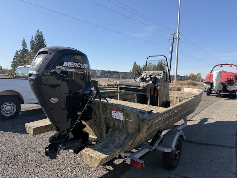 Crestliner 1860 Retriever CC boat with Mercury outboard motor on trailer.