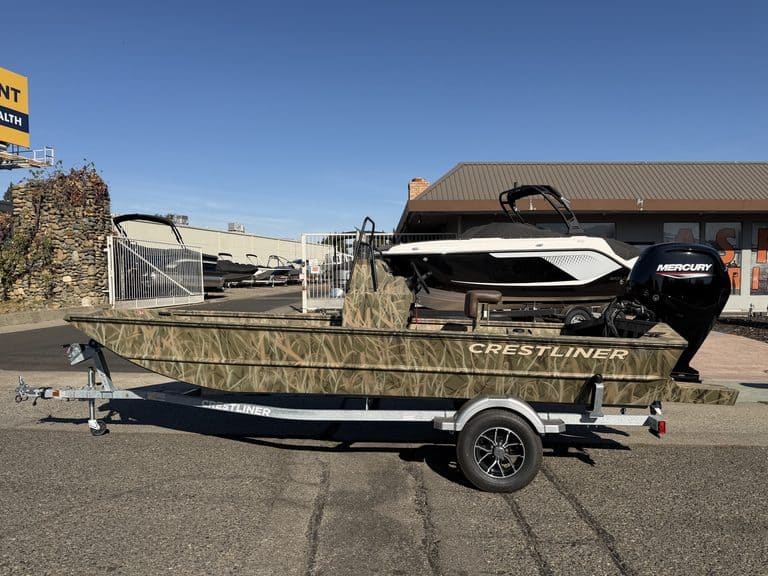 Crestliner 1860 Retriever CC fishing boat on trailer with Mercury outboard.