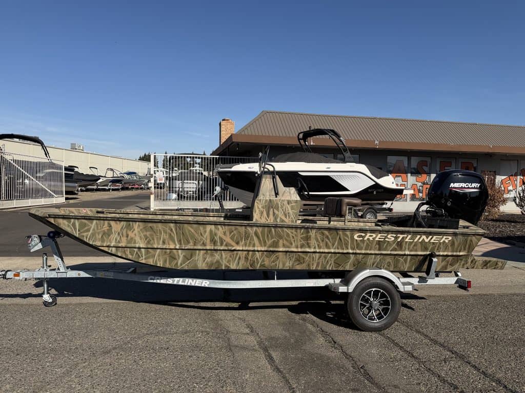 Crestliner 1860 Retriever CC fishing boat on trailer at dealership.