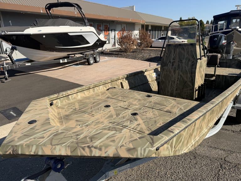 Crestliner 1860 Retriever CC fishing boat with camouflage pattern.