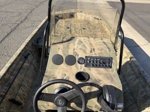 View of Crestliner 1860 Retriever CC boat dashboard and steering wheel.
