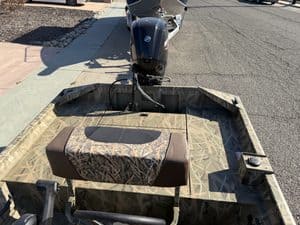 Crestliner 1860 Retriever CC fishing boat with outboard motor.