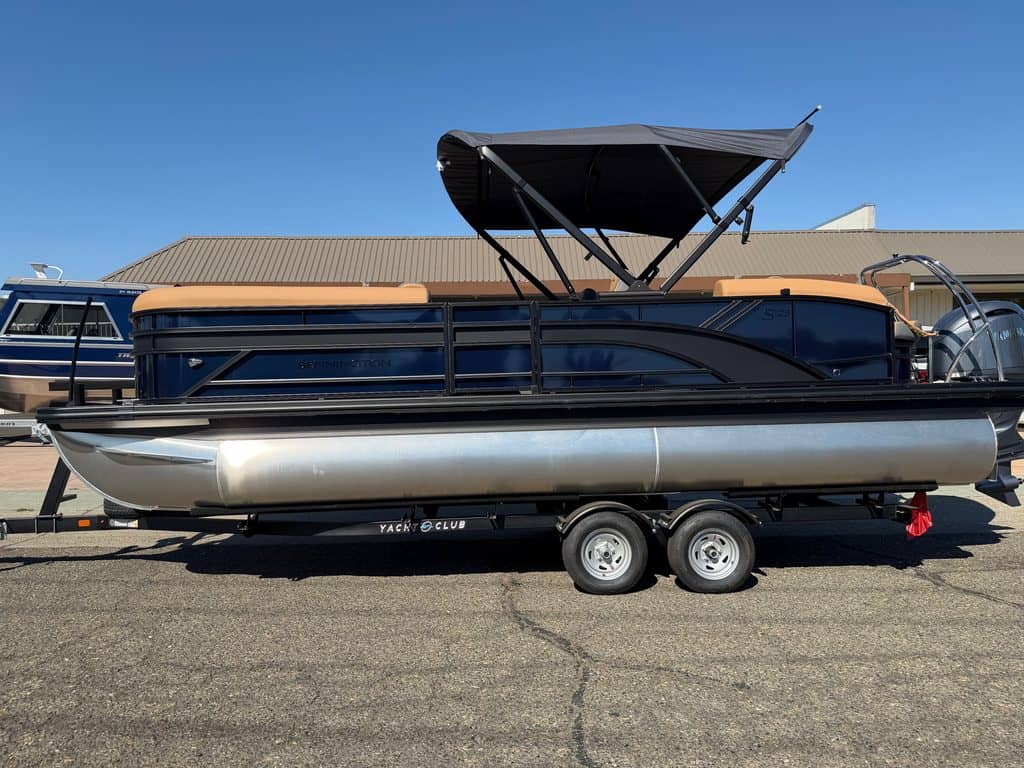 Bennington S 23FT Tri Toon pontoon boat with 200HP engine on trailer.