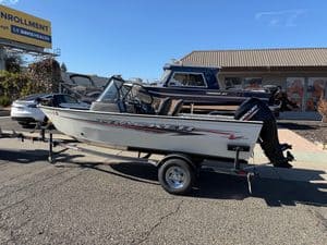 Tracker Pro boat with Mercury 60HP outboard motor on trailer.