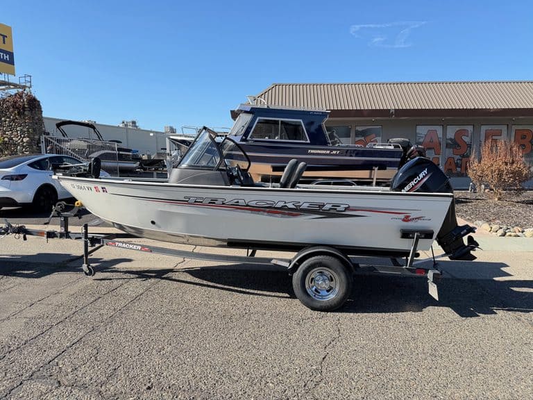 Tracker Pro boat with Mercury 60HP outboard motor on trailer.