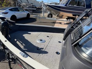 Boat deck with Mercury 60HP outboard motor at ASFB Marine.