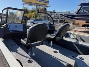 View of boat interior with seats and controls at ASFB Marine.