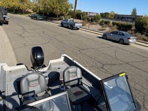 View of boat interior with two seats and windshield at ASFB Marine.