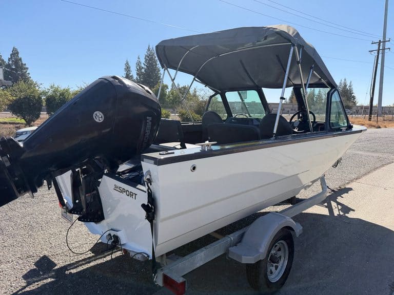 Powerboat with outboard motor on trailer at ASFB Marine.