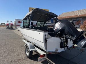 Small motorboat with outboard engine on trailer at ASFB Marine.