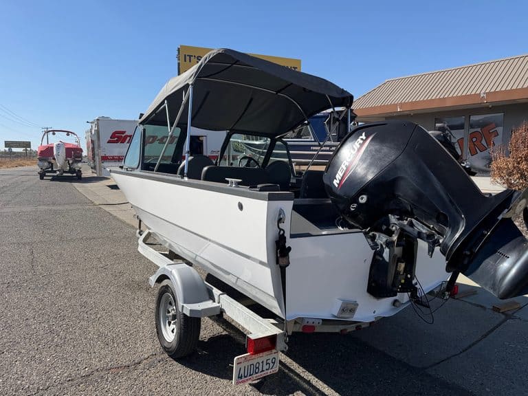 Small motorboat with outboard engine on trailer at ASFB Marine.
