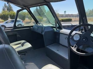Interior view of an ASFB Marine utility vehicle with dashboard and seating.