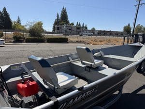 Klamath 15FT Advantage fishing boat with seats and motor.