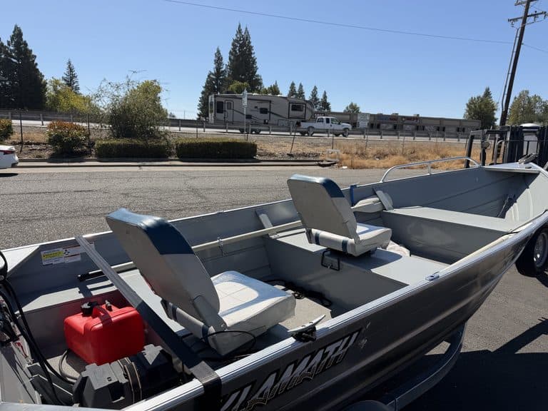 Klamath 15FT Advantage fishing boat with seats and motor.