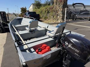 Klamath 15FT Advantage boat with Tohatsu outboard motor and seating.