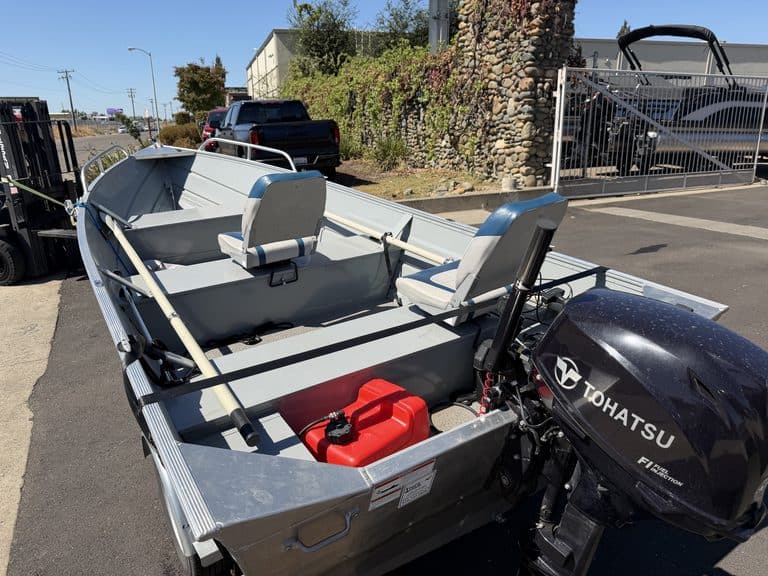 Klamath 15FT Advantage boat with Tohatsu outboard motor and seating.