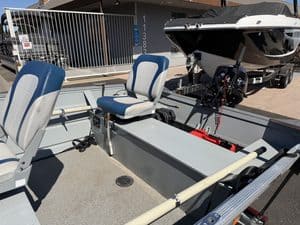 Klamath 15FT Advantage fishing boat with seats and motor.