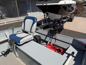 Klamath 15FT Advantage boat with outboard motor and seating.
