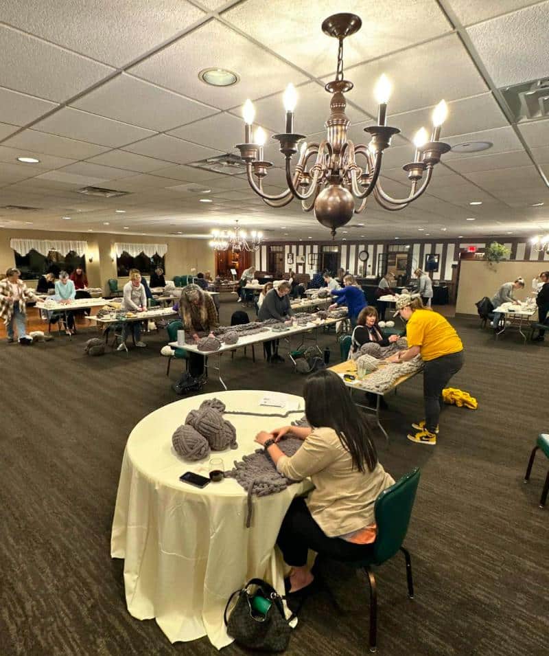 Indoor craft workshop at Cascades Manor with guests engaging in creative activities.
