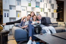 A family group posing during an event for Roche Bobois in Brussels