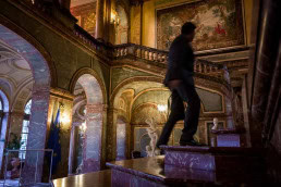 A person going up the stairs at the Palais d'Egmont during the McKinsey Awards event in Brussels