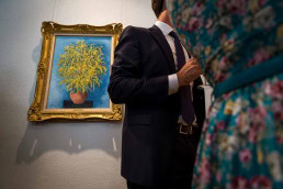 Visitors appreciating art during an art exhibition event by Sotheby's in Brussels