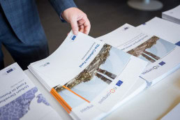 One of the booklets being taken by a guest during a conference for EURADA in Brussels