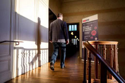 A man walks to the networking area during the The Economist Digital Openness in Europe conference