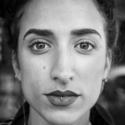 Black and white closeup portrait of a woman from France taken in Brussels