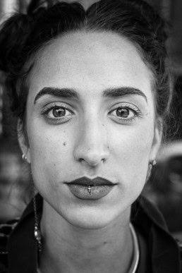 Black and white closeup portrait of a woman from France taken in Brussels