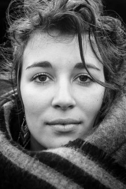 Black and white closeup portrait of a woman from France taken in Brussels