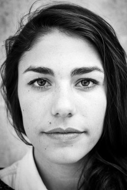 Black and white closeup portrait of a woman from France taken in Brussels