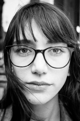 Black and white closeup portrait of a woman from France taken in Brussels