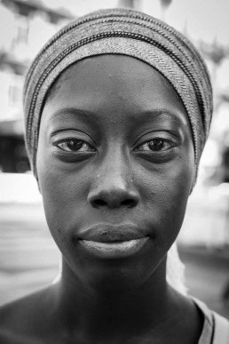Black and white closeup portrait of a woman from Senegal taken in Brussels