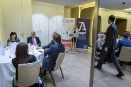 A speaker engages with the audience during a meeting conference in Brussels