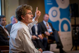 A speaker engaging with the audience during a conference for JA Europe in Brussels