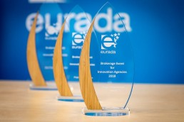 Prizes in front of an EURADA banner background during an event in Brussels for EURADA