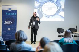 A speaker giving his lecture walking towards the audience during an event for EURADA in Brussels