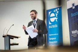 A speaker giving his lecture during an event for EURADA in Brussels