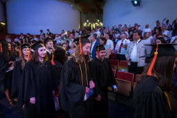 Vesalius College soon to be bachelors enter the auditorium in Brussels