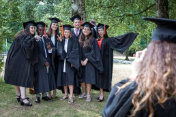 A group of Vesalius College bachelors pose in their graduation day in Brussels