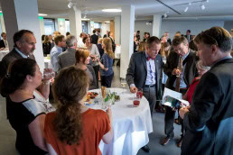 A room full of attendants and guests during an event in Brussels