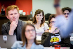 A workshop participant smiling during a workshop event for JA Europe in Brussels