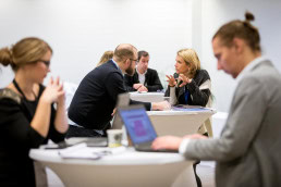 People engaging during a networking event for EURADA and Watify in Brussels