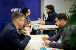 People engaging during a networking event for EURADA and Watify in Brussels