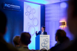 A speaker engages with his audience during the CS International Conference in Brussels